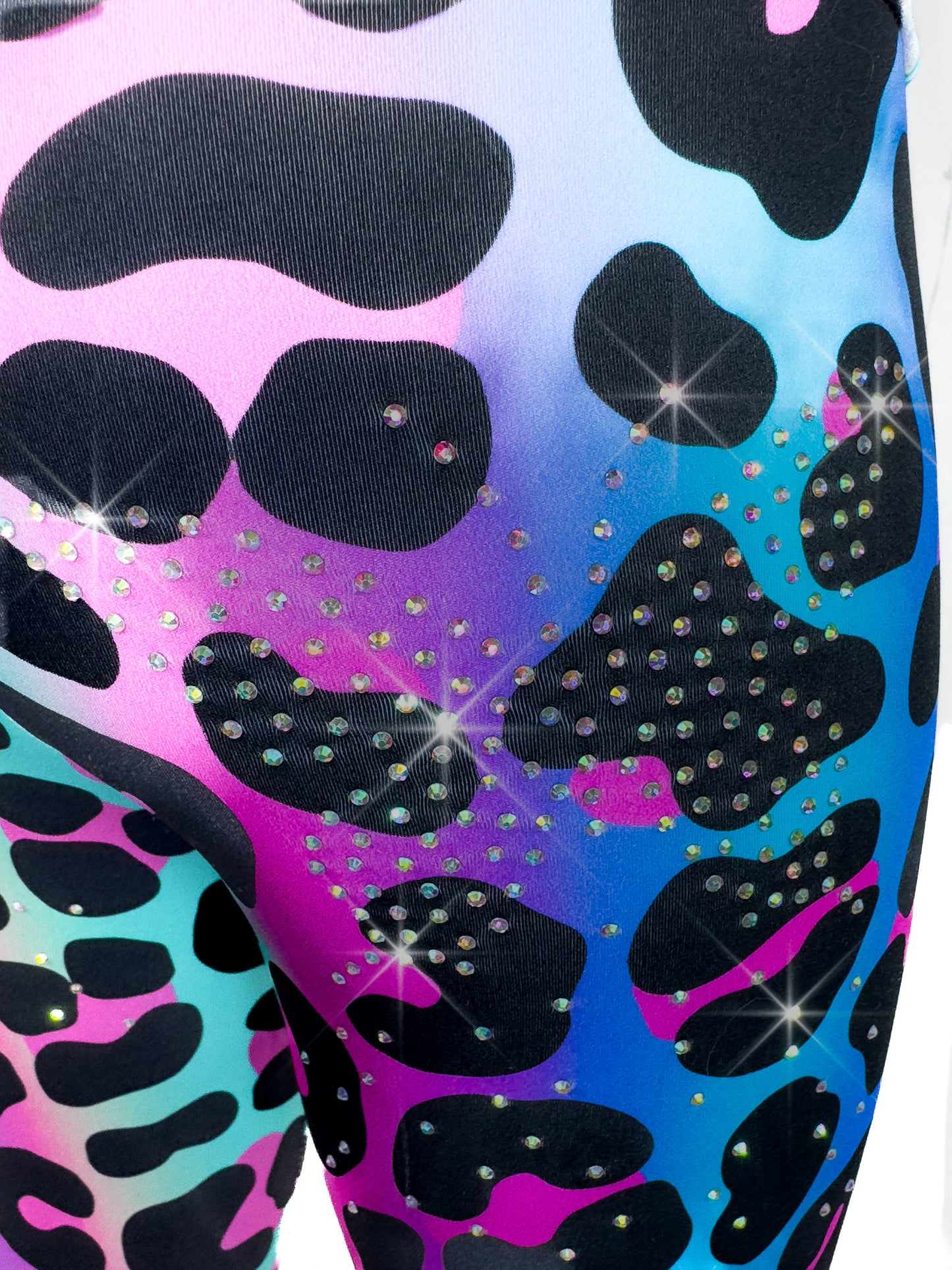 Close up back view of Tailys sparkly rhinestone shorts for girls rainbow leopard leggings tail pants.