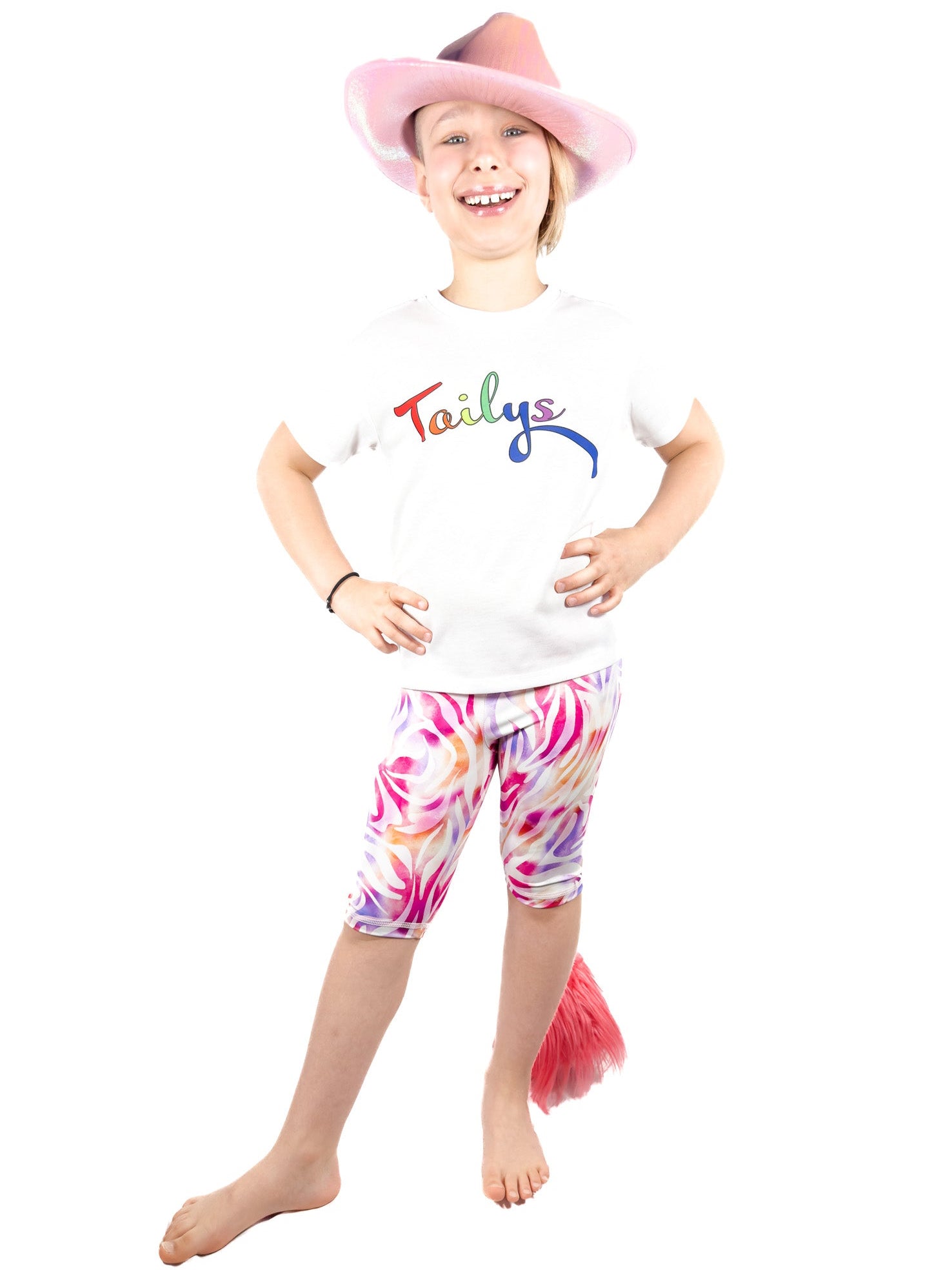 Cute girl wearing Tailys, girls shorts, pastel zebra leopard print leggings tail pants.