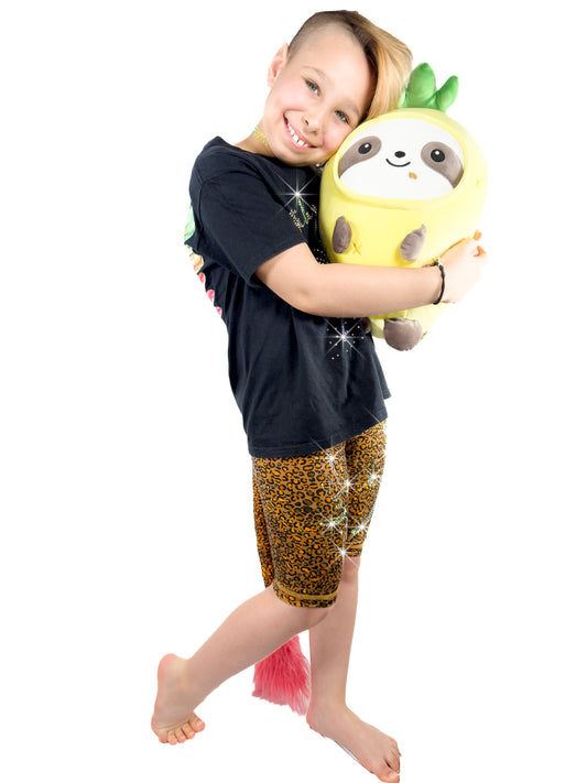 Girl with toy wearing Tailys sparkly rhinestone shorts for girls, brown cheetah print leggings tail pants.