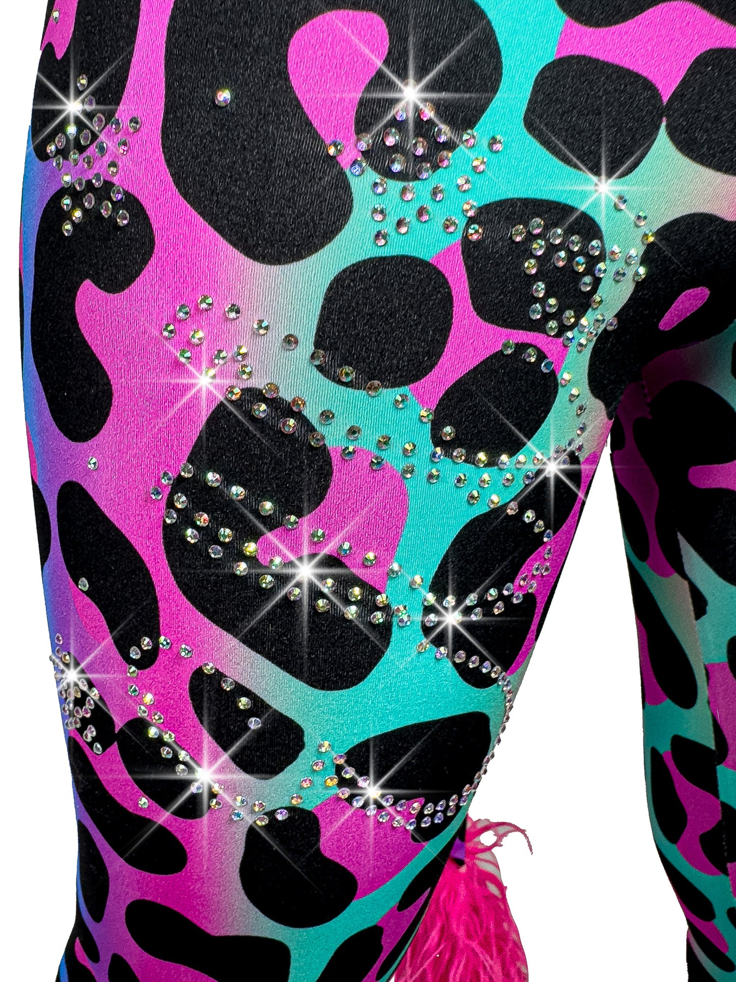 Fully personalized gift rhinestone design on leg of rainbow leopard leggings.