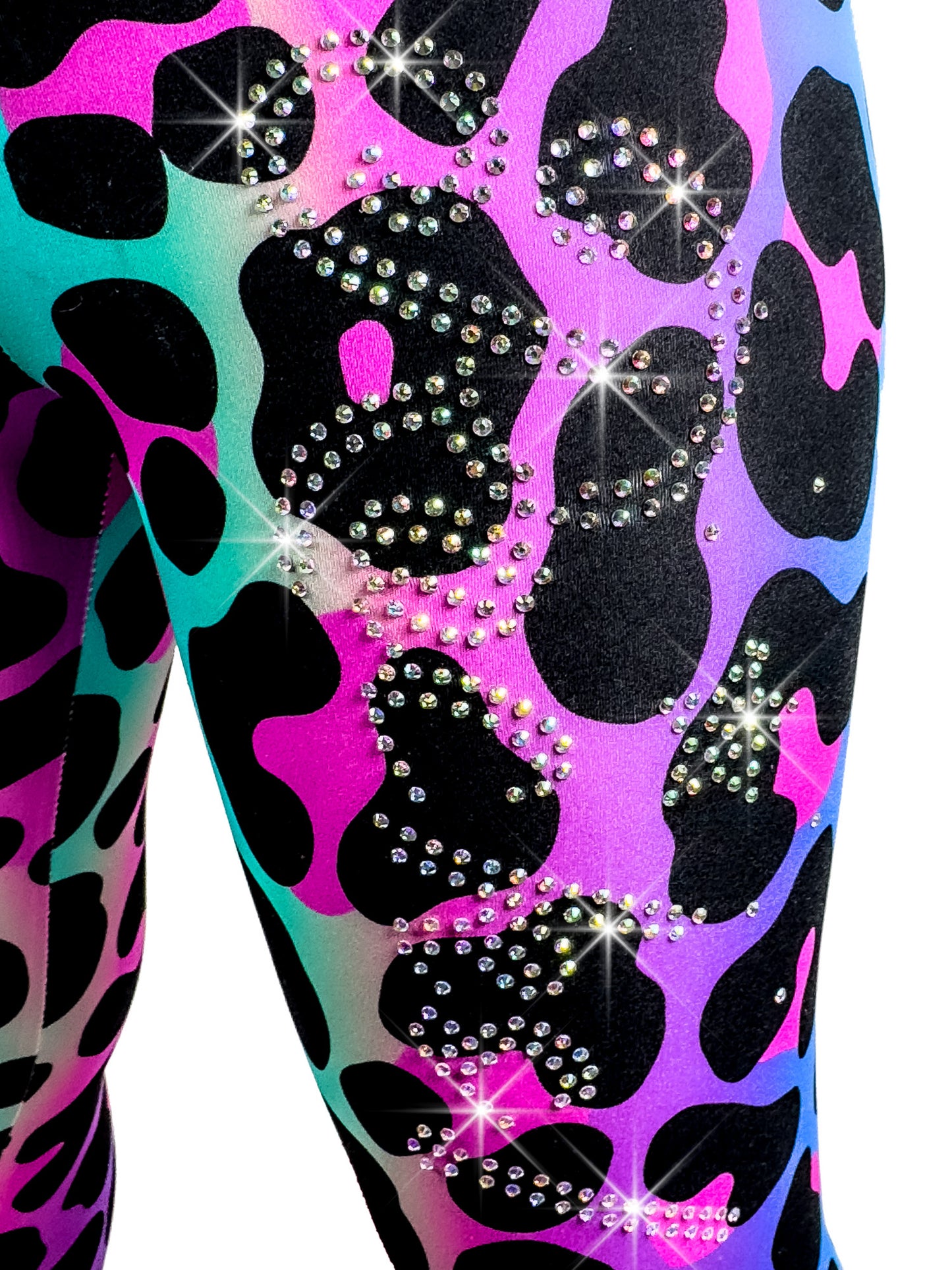 Fully personalized gift rhinestone design rocks on leg of rainbow leopard leggings.