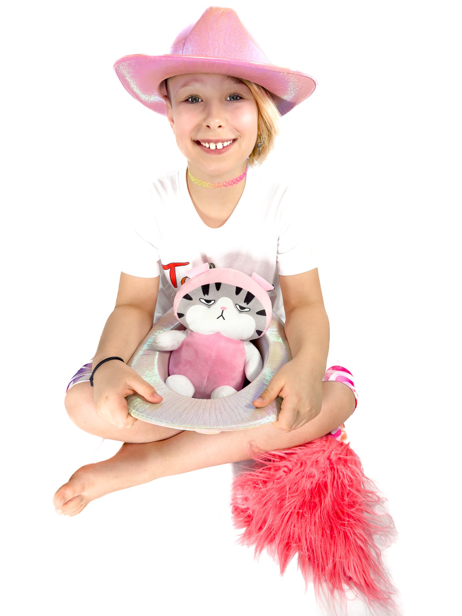 Cute girl, with cat  toy, wearing sparkly rhinestone pastel zebra shorts leggings with a tail by Tailys.