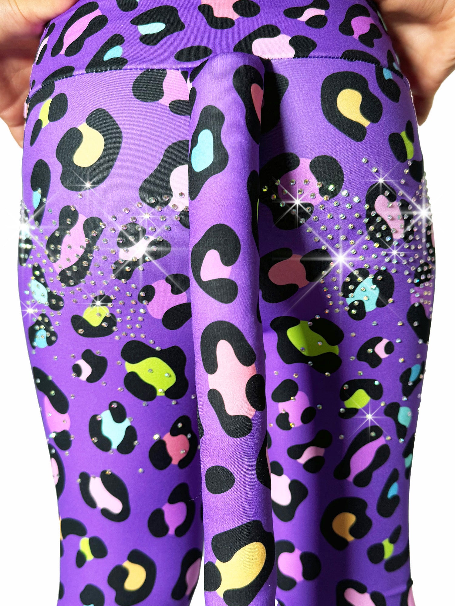 Back closeup of Tailys custom yoga pants leggings, purple leopard fabric, with a beautiful tail and sparkling rhinestones