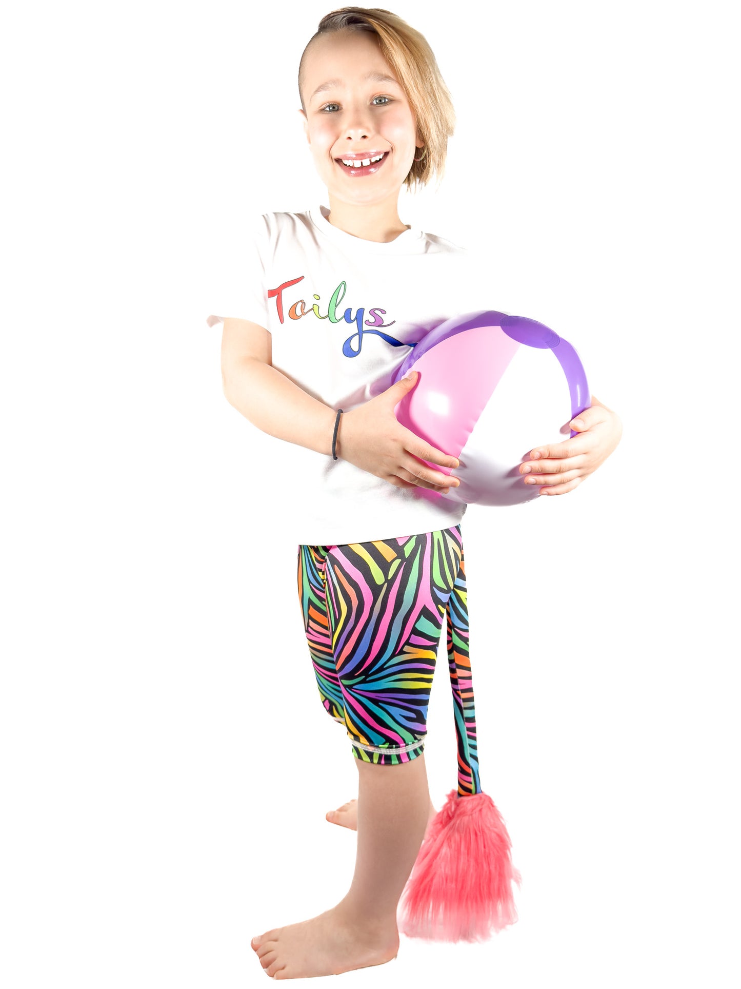 Cute girl wearing Tailys kids shorts for girls rainbow zebra leggings tail pants.