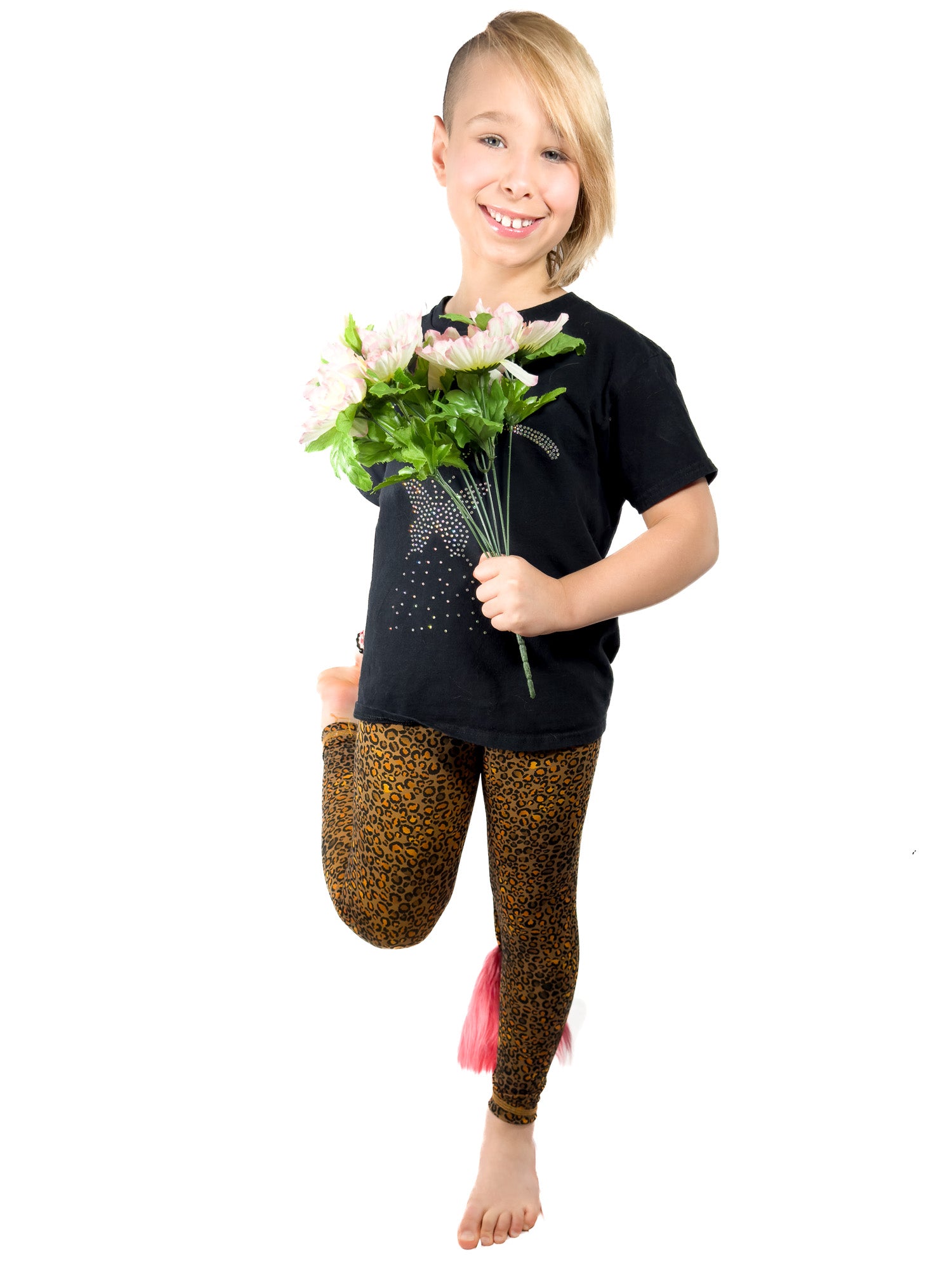 Happy girl wearing original brown, cheetah leggings with rhinestones girls tail pants.