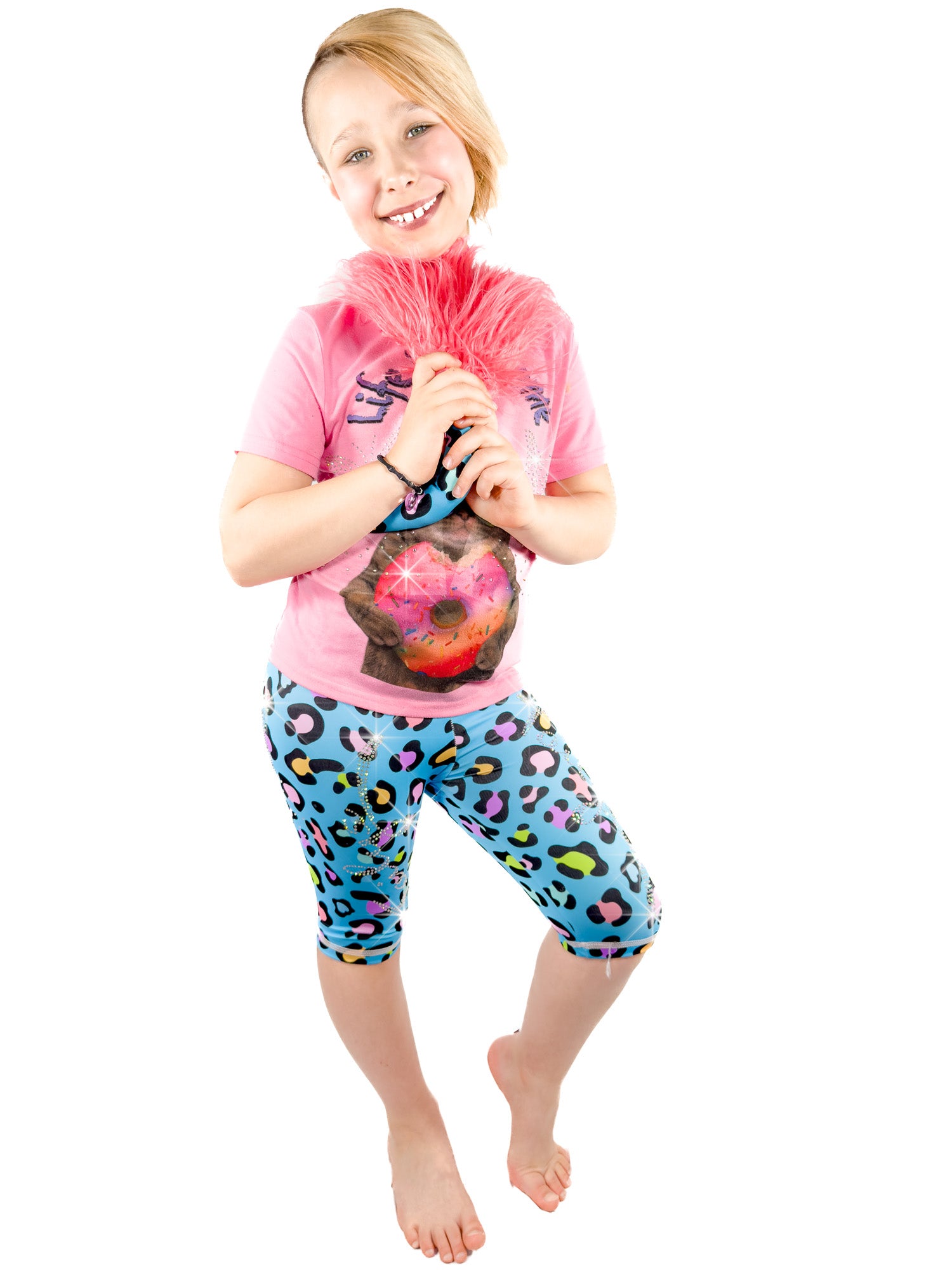 Girl holding tail, wearing Tailys rhinestone shorts for girls blue leopard print leggings tail pants.