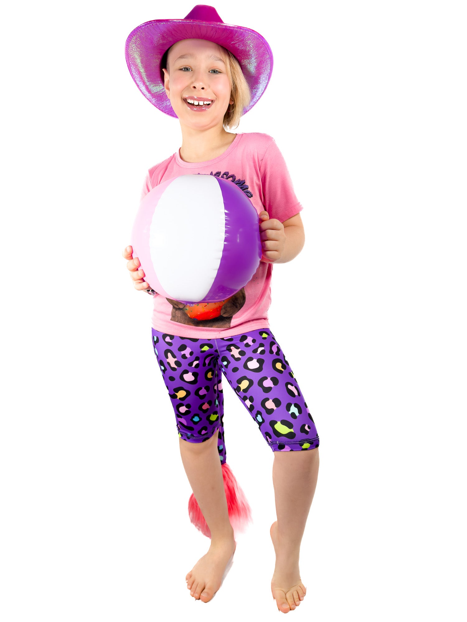 Girl holding ball wearing view of Tailys cute shorts for girls purple leopard print leggings tail pants.
