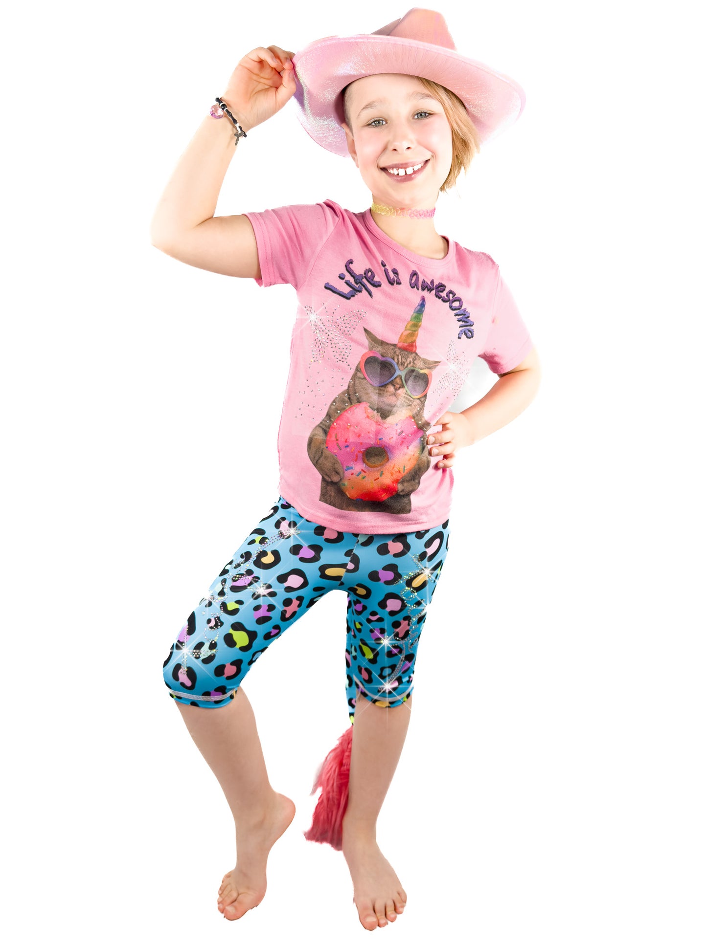 Girl wearing Tailys rhinestone shorts for girls blue leopard print leggings tail pants.