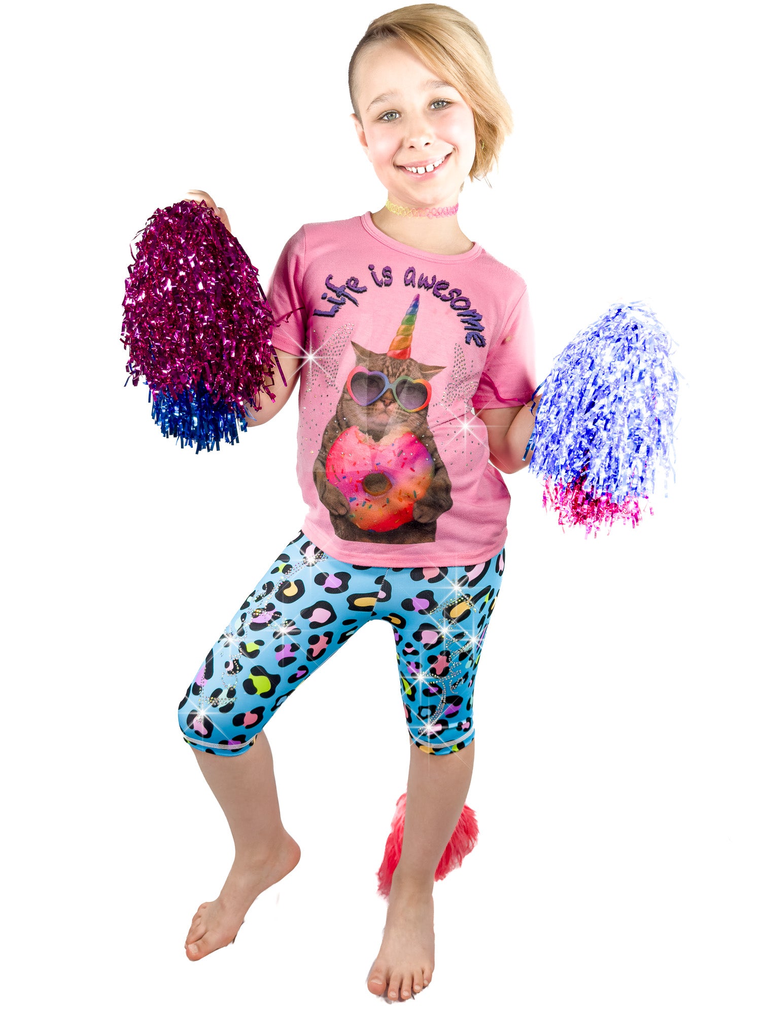 Girl with pom-poms wearing Tailys rhinestone shorts for girls blue leopard print leggings tail pants.