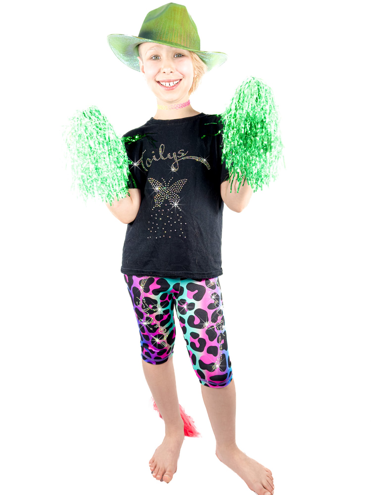 Girl with pom-poms wearing Tailys sparkly rhinestone shorts for girls rainbow leopard leggings tail pants.