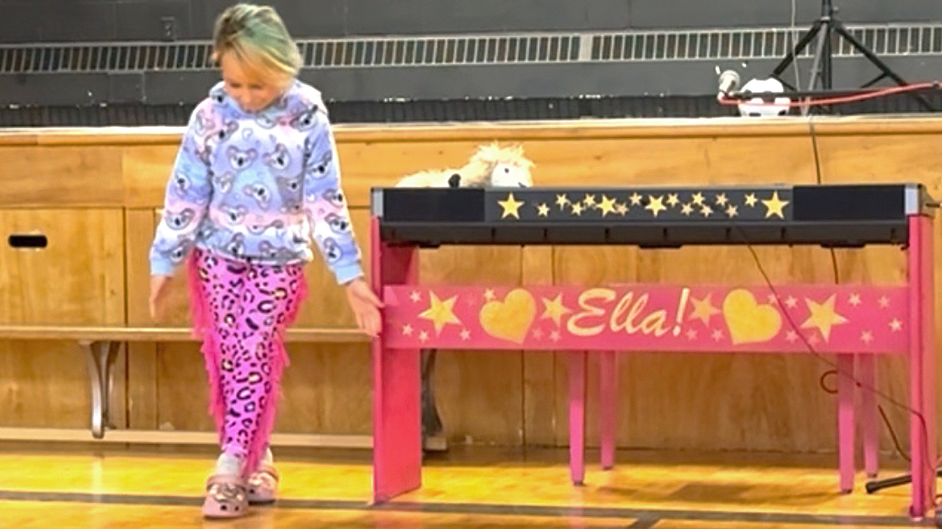 Load video: Movie of Ella performing song on piano, and showing how much Tailys have changed her life.